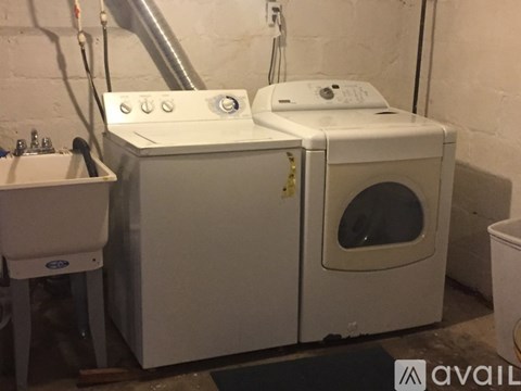 A white washing machine and dryer are available for use.