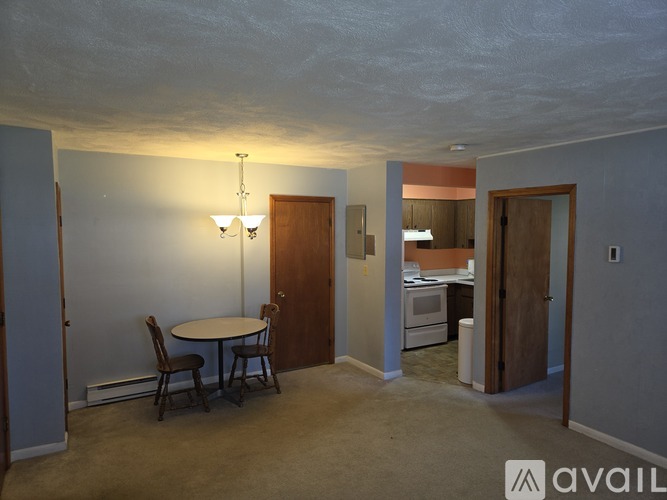 A room with a table and chairs in it.