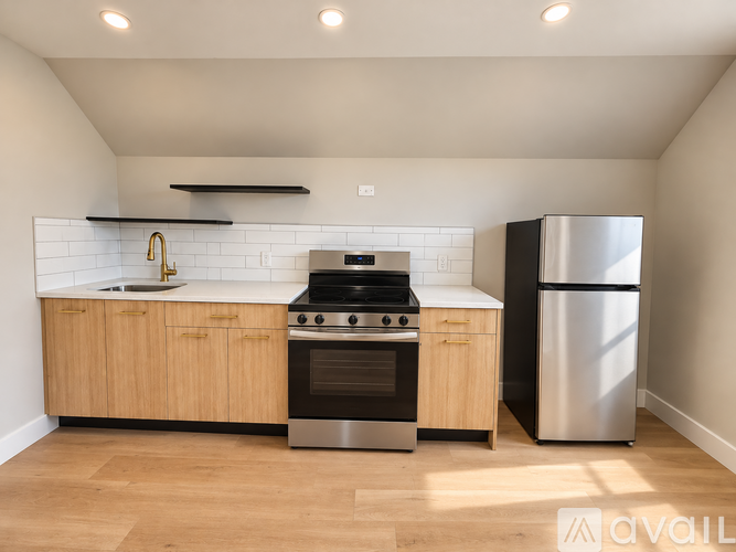 A modern kitchen with wooden cabinets and stainless steel appliances.