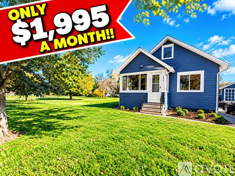 A blue house with a red sign that says "ONLY $1,995 A MONTH!".