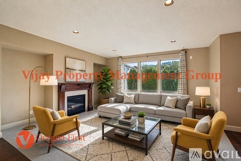 A living room with a fireplace and a couch.