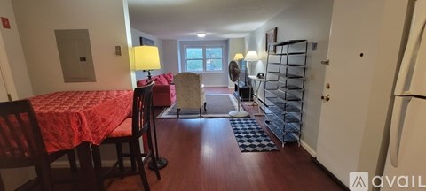 A kitchen with a table and chairs in the middle of the room.