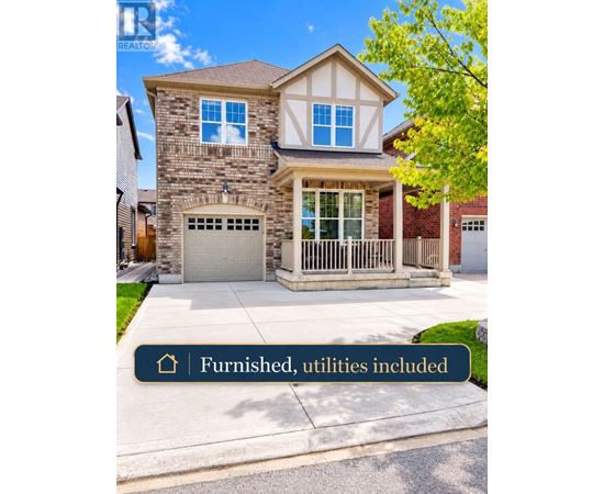 A house with a stone facade and a garage.