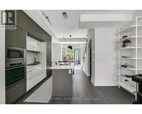 A modern kitchen with a large island in the middle.