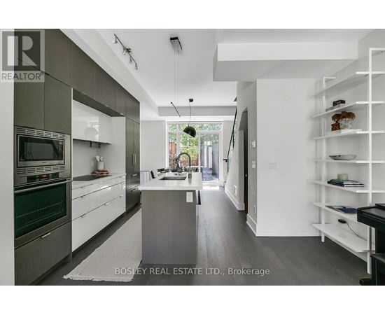 A modern kitchen with a large island in the middle.