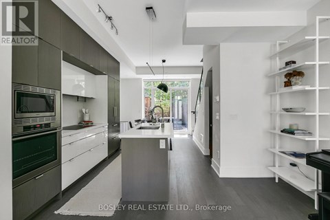 A modern kitchen with a large island in the middle.