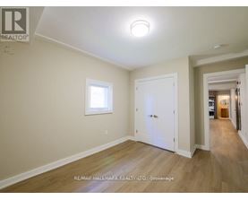 A room with a white door and a window.