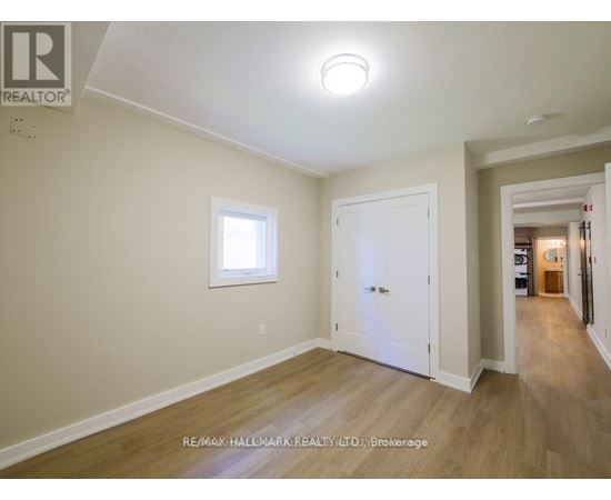 A room with a white door and a window.