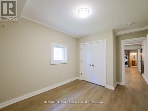 A room with a white door and a window.
