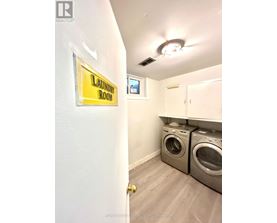 Laundry room with washers and dryers.