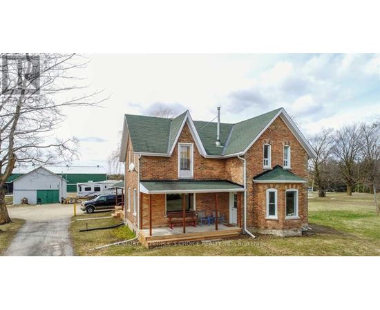 A brick house with a green roof and a sign that says "Century Realty".