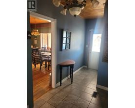 A room with a table and chairs in it.