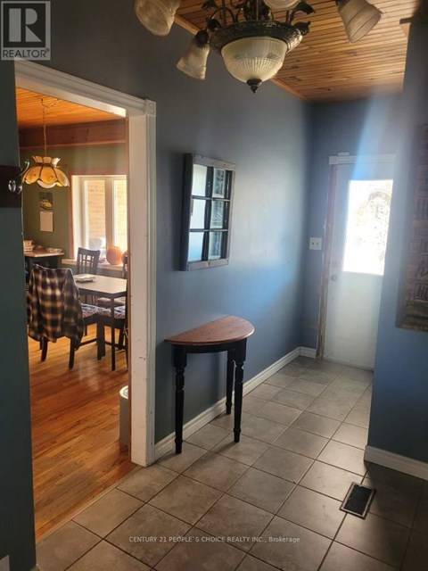 A room with a table and chairs in it.
