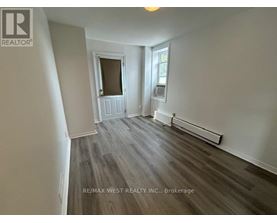 A room with a window and a door in it.