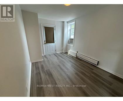 A room with a window and a door in it.