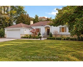 A house with a white garage door and a brown roof.