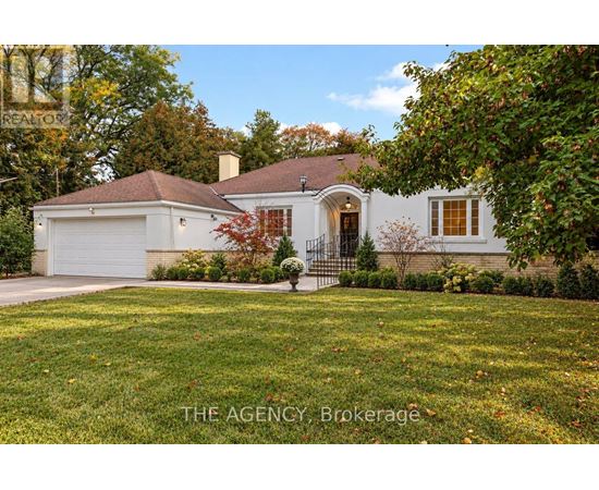 A house with a white garage door and a brown roof.