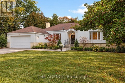 A house with a white garage door and a brown roof.