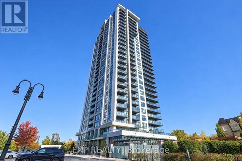 A tall building with a clear blue sky in the background.