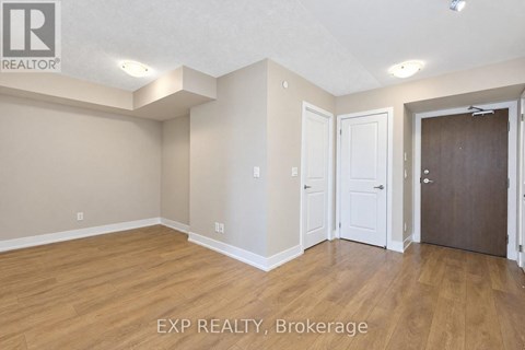 A room with EXP REALTY, Brokerage written on the floor.