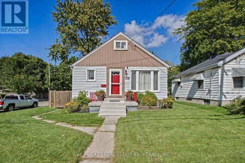 A house with a red door is for sale.