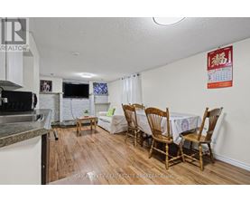 A dining room with a table set for four.