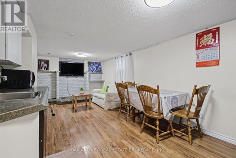 A dining room with a table set for four.