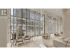 A waiting area with chairs and a wall of windows.