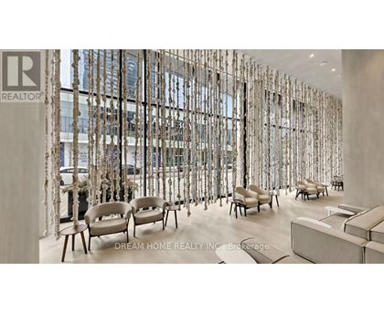 A waiting area with chairs and a wall of windows.