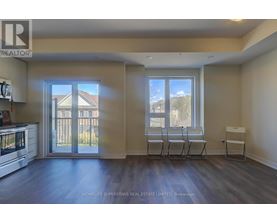 A realtor's office with a view of a house through the window.