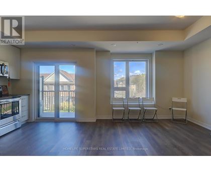A realtor's office with a view of a house through the window.