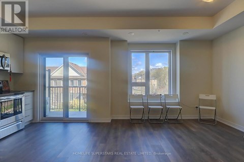A realtor's office with a view of a house through the window.
