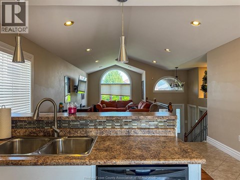 A kitchen with granite countertops and a large island.