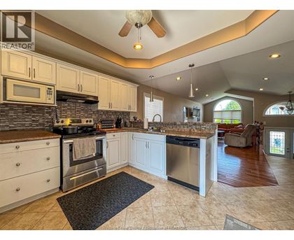 A kitchen with a stove top oven and a microwave.