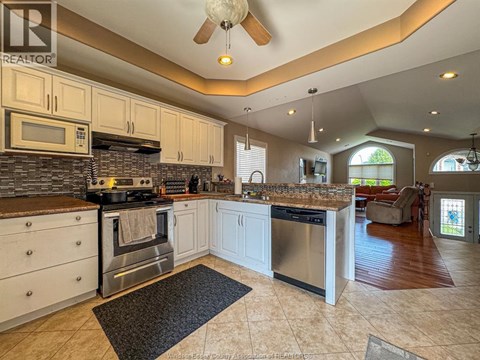 A kitchen with a stove top oven and a microwave.