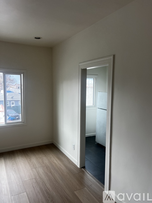 A room with a door and a window.