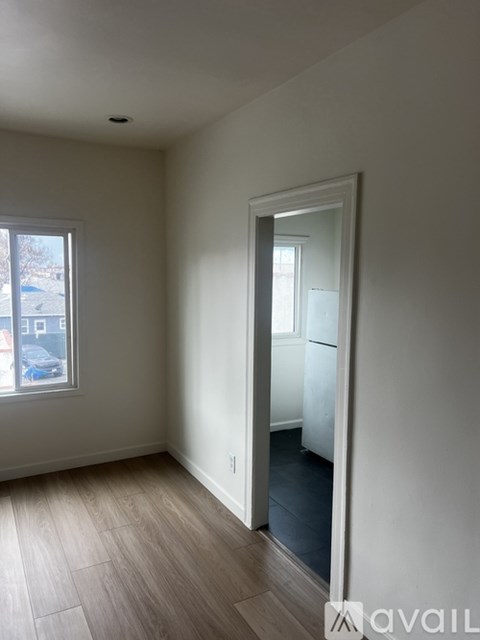 A room with a door and a window.