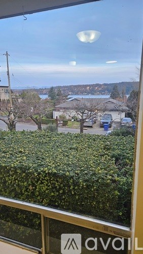 A view from a window looking out at a residential area.