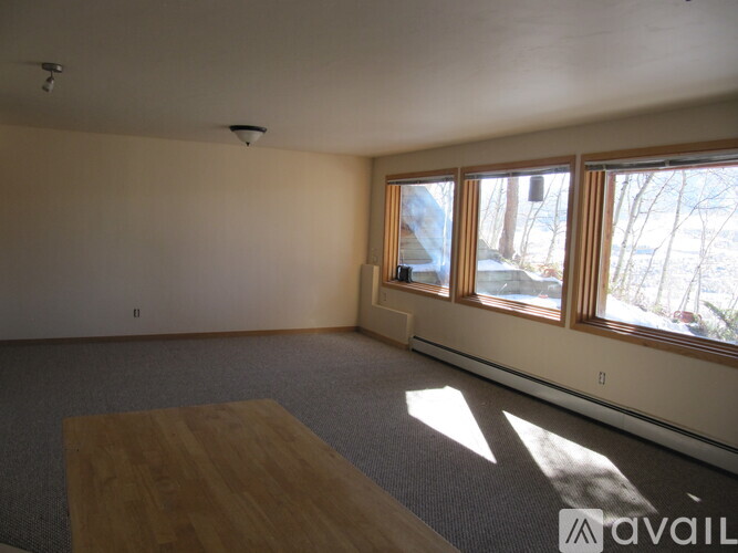 A room with a table and a window.