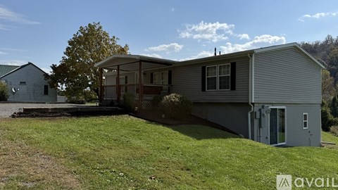 A house with a grey exterior is available for rent.