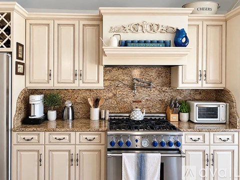 A kitchen with a stove top oven and a microwave.
