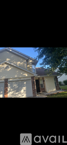 A house with a garage door is shown.