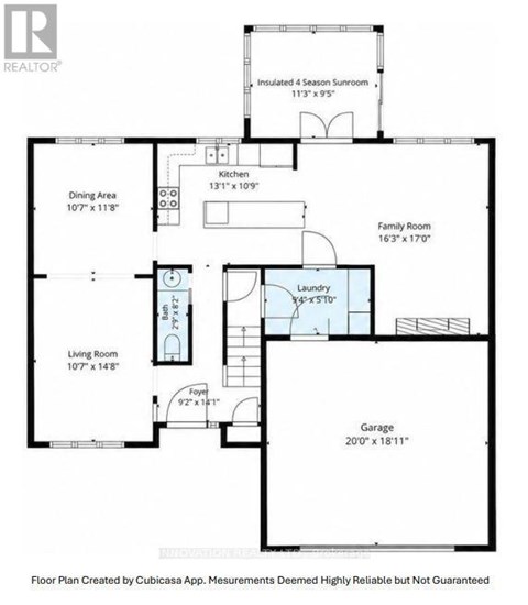 A floor plan for a house with a living room, dining area, kitchen, family room, laundry, and garage.
