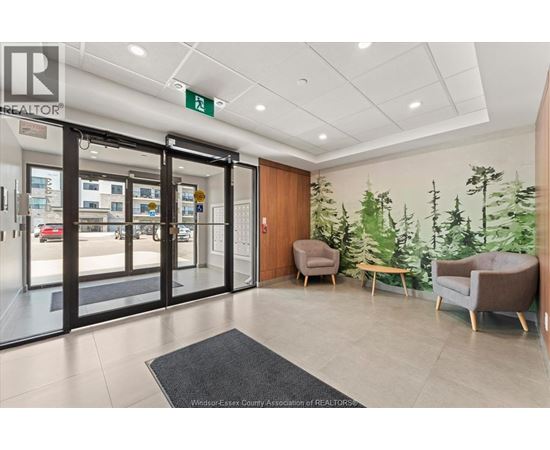 A realtor office with a glass door and a green sign on the wall.