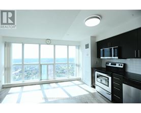 A modern kitchen with a view of the city.