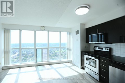 A modern kitchen with a view of the city.