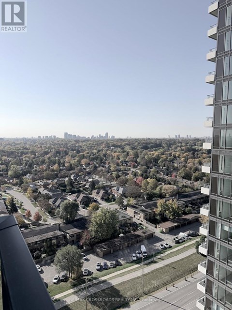 A view from a high-rise building looking down at a residential neighborhood.
