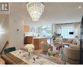 A well-lit, modern living room with a dining table set for two.