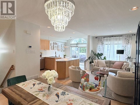 A well-lit, modern living room with a dining table set for two.