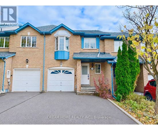A two-story house with a blue garage door.
